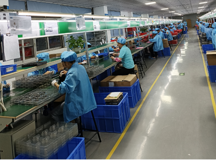 Staff working at an electronics assembly line
